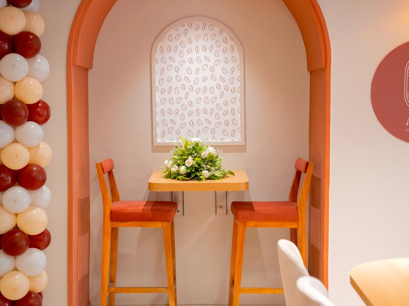 Cozy atmosphere at Aristo Cafe with comfortable seating perfect for friends and family gatherings